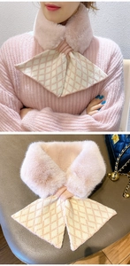 Detail of light pink knitted faux fur scarf with criss-cross pattern and soft texture