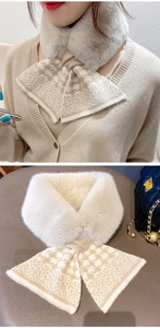 Detail view of cream knit scarf with faux rabbit fur trim and houndstooth pattern