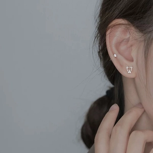 Minimalist asymmetric silver calf earrings with sparkling zircon for a sweet feminine look