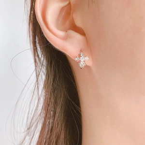Gothic silver cross huggie earrings with sparkling crystals for a trendy luxury look