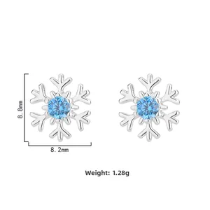 Detailed view of snowflake stud earrings showing dimensions 8.8mm by 8.2mm and 1.28g weight