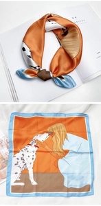 Détail d'un foulard en soie carré avec illustration de femme et chien, orange et bleu