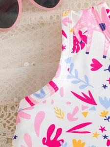 Detailed macro view of girls cotton vest neckline with cute cartoon giraffe and leaf patterns