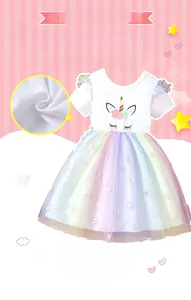 Close-up of soft breathable cotton fabric and colorful rainbow mesh layers on girl dress
