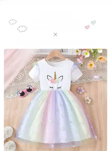 Detail of girls unicorn rainbow dress with sequins and colorful layered tulle skirt