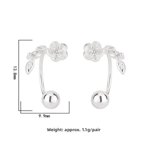 Macro detail of silver flower stud earring with cubic zirconia showing 13.8mm dimensions