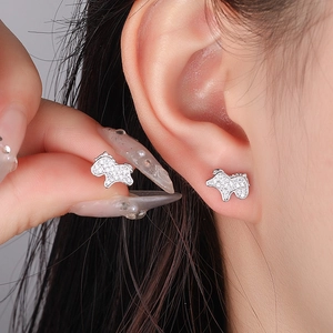 Elegant silver horse stud earrings with white cubic zirconia worn by model