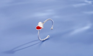Close-up of S925 sterling silver adjustable ring with red and white enamel heart detail