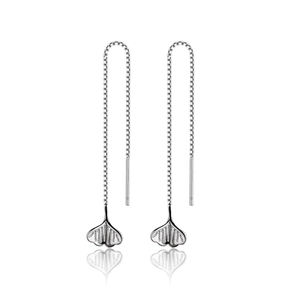 Macro shot of silver ginkgo leaf tassel earrings with sleek reflective surface