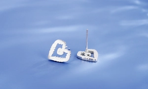 Detailed view of matte s925 silver heart stud earrings with brushed metal texture finish