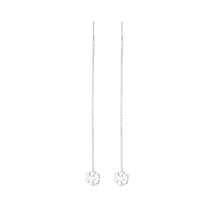 Macro detail of silver snowflake drop earrings with minimalist long chain design