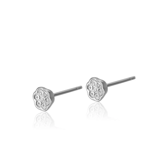 Minimalist silver lotus flower stud earrings for women with detailed texture on white background