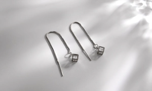 Detailed view of S925 silver threader earrings with hollow cube and cubic zirconia