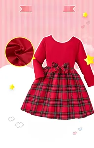 Close-up of red knit bodice and classic red plaid skirt detail on a girls' Christmas dress