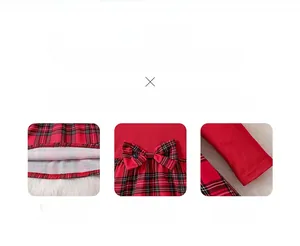 Detail of red and black plaid Christmas dress featuring bow decor and sewing craftsmanship