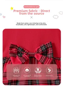 Detail of red and black plaid bow on cotton Christmas party dress for girls