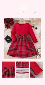 Detail of red plaid Christmas dress featuring delicate mesh embroidery and fine stitching