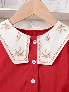 Girls red princess dress with embroidered white Peter Pan collar and white buttons