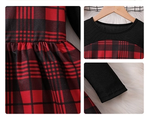 Detail of red plaid skirt texture and round neck splicing on winter girl dress