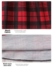 Detail of red plaid girls' dress showing layered soft tulle mesh and fine stitching