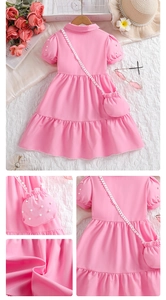 Detail of pink cotton princess dress featuring pearl puff sleeves and matching pearl bag