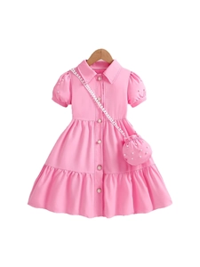 Pink girls' dress with puffed sleeves, pearl buttons, layered skirt, and matching bag