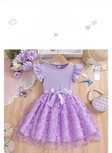 Detail view of purple girls dress featuring 3D butterfly appliques and soft mesh tutu skirt