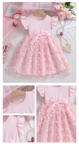 Detail of pink girls dress with delicate mesh skirt and 3D butterfly floral appliques