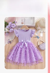 Detailed flat lay of a girls purple tulle dress with 3D butterflies and bow belt