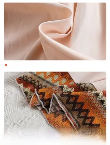 Detail view of mesh fabric and layered skirt with ethnic geometric patterns on a girls dress