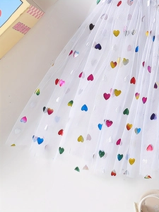 White tulle skirt for girls featuring colorful heart sequins and multi-layer tutu design