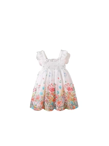 Vestido playero blanco con flores para niñas con corpiño elástico y volantes