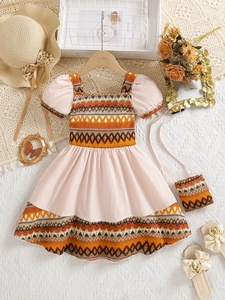 Bohemian girls summer dress with puff sleeves and geometric patterns plus mini bag