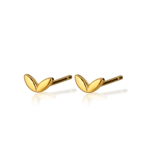 Macro shot of minimalist gold four-leaf clover stud earrings with smooth polished finish