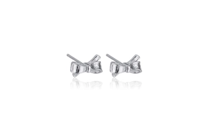 Close-up of S925 sterling silver bow knot stud earrings with a polished metallic finish