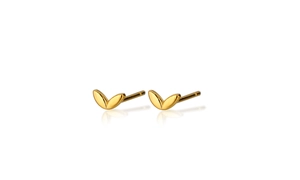 Detailed view of pair of gold minimalist leaf stud earrings on white reflective background