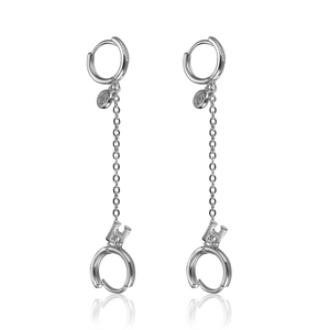Detail of s925 silver earring featuring a long tassel chain and an H letter pendant