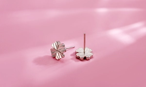 Macro detail showing the radial engraving and matte texture of S925 silver clover studs