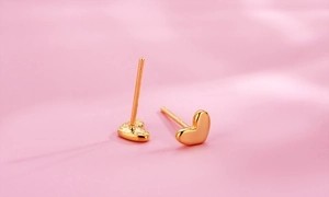Macro shot of 18K gold-plated S925 silver minimalist heart-shaped stud earrings
