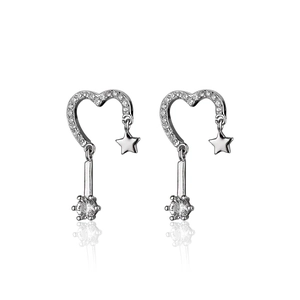Detail of s925 silver earrings with heart and star charms and sparkling round zircon