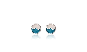 Detail of round mountain wave stud earrings with blue drip glaze and silver base