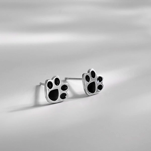 Minimalist silver and black cat paw stud earrings for women with creative animal design