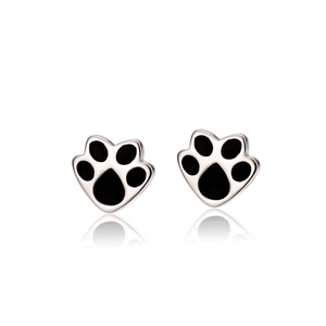 Minimalist silver cat paw earrings with black enamel inlay on reflective white background