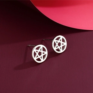 Minimalist S925 silver hollow star round stud earrings on a dark red background