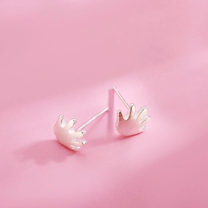 S925 sterling silver palm shaped stud earrings with matte finish on pink background