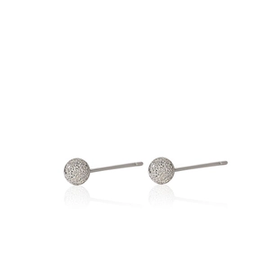 Detailed view of S925 sterling silver ball earrings with frosted sand finish and soft reflections