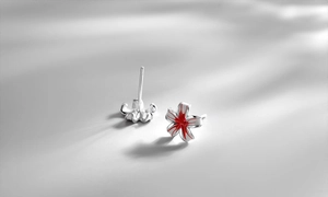 Close-up of S925 sterling silver peach blossom earrings with red enamel and butterfly backs