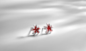 Detail of S925 sterling silver peach blossom stud earrings with red enamel flower petals
