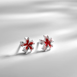 S925 sterling silver peach blossom stud earrings with red enamel on grey background
