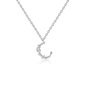 Close-up of silver crescent moon pendant necklace with sparkling cubic zirconia inlay